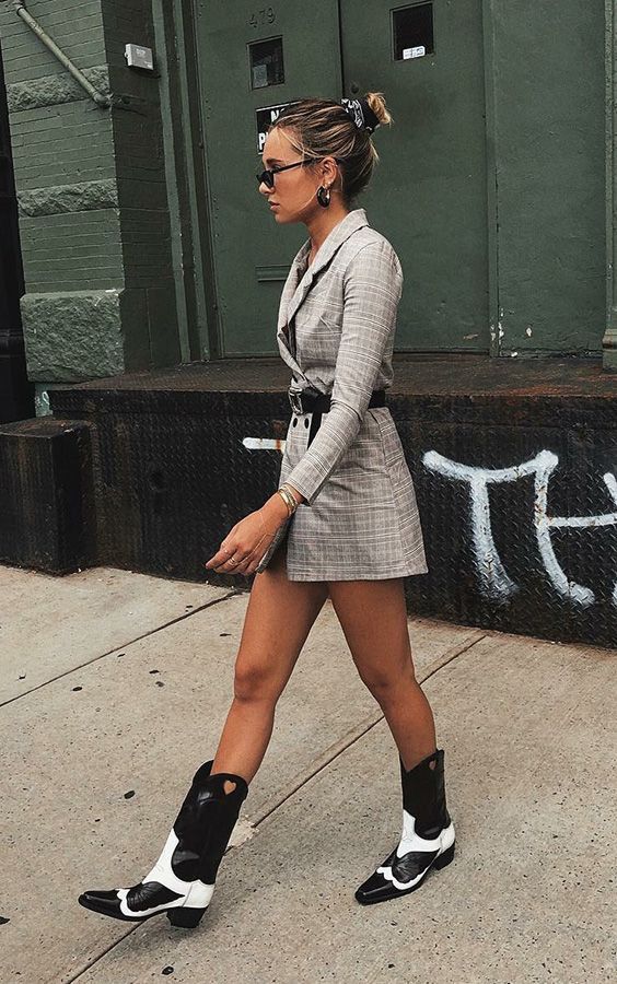 a grey plaid blazer mini dress with a belt, black and white cowboy boots for a chic look