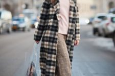 a whimsy outfit with a pink hoodie, cropped wideleg pants, white booties, a plaid coat and a sheer bag