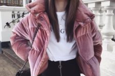 an edgy look with a white printed tee, black high-waisted jeans, a pink velvet puffer jacket and a black bag