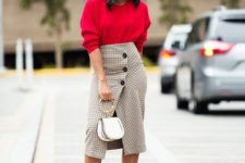 08 a red oversized jumper, a grey plaid pencil skirt on buttons, black sock boots and a white bag on a ring handle