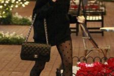 With black sweater dress, black beret, chain strap bag and black boots