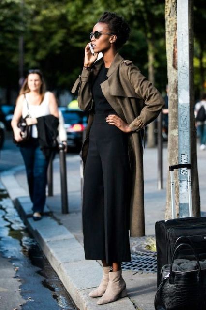 With black top, black culottes and gray boots