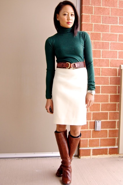 With emerald turtleneck, brown belt and brown leather boots