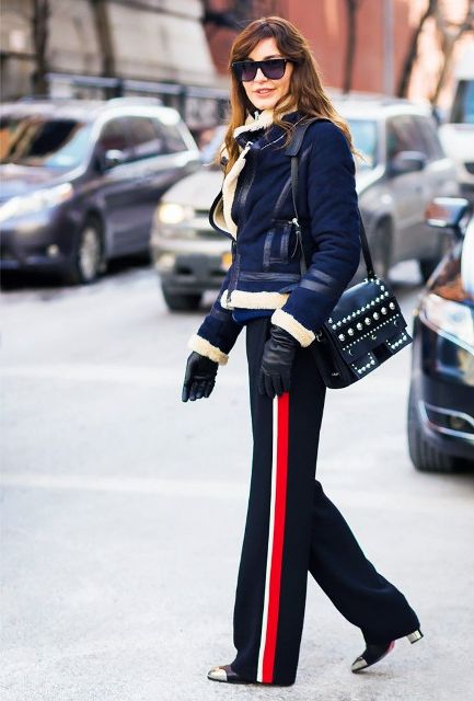 With navy blue jacket, two colored boots and embellished bag