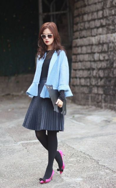 With pleated skirt, hot pink shoes, black blouse and clutch