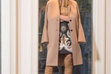 With printed skirt, beige turtleneck, hat and suede over the knee boots