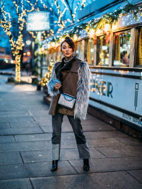 With sweater, patchwork jeans, crossbody bag and black boots