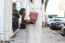 With white blouse, brown clutch and brown ankle boots