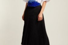 With white button down shirt, black pleated midi skirt and lace up boots