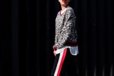 With white shirt, leopard sweatshirt and black shoes