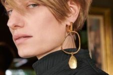 a large and bold mono earring with an asymmetric part and a large stone will spruce up your outfit