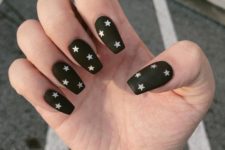 a matte black manicure with nude stars will make your look whimsier and cooler