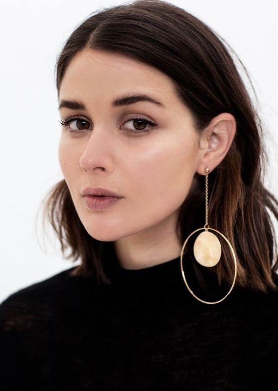 a statement mono earring with a large stone and a large circle is a bold idea