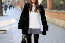 a white sweater, a tweed A-line mini skirt, black tights, animal print shoes, a black coat and a black bag