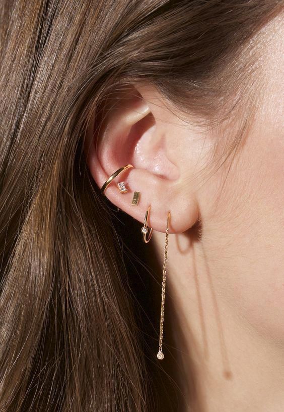 a whole set of hoops, studs and even hanging earrings done in gold and diamonds is a stylish minimalist idea