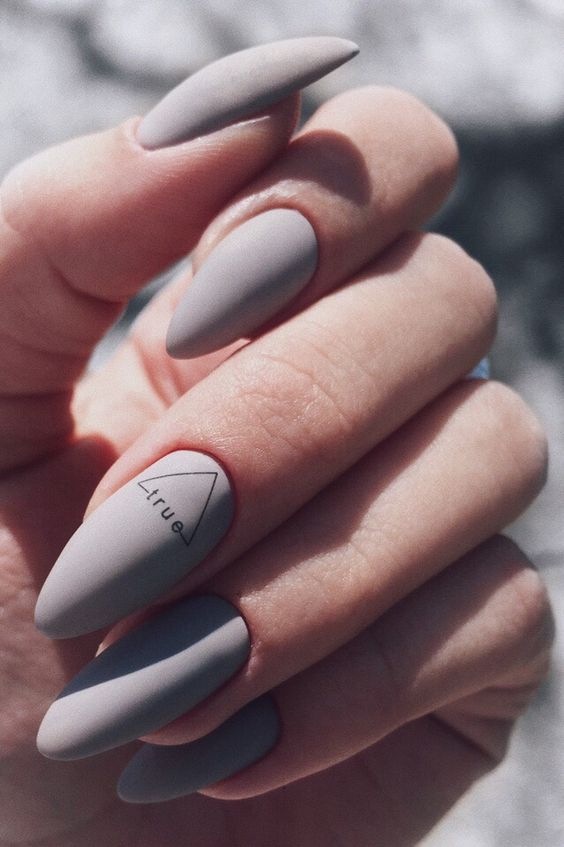 matte grey nails with an accent for a modern and trendy look in a neutral shade