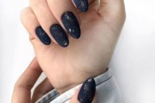 matte nails with gold glitter chaotically placed on them for a more eye-catchy and natural look