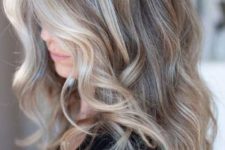 mushroom blond with balayage and with slight waves is a trendy idea, especially for edgy medium hair length
