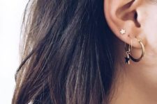 two hoop earrings with a single star hanging and a star stud to match the look