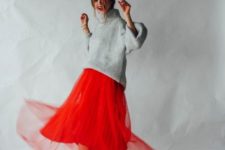 05 an oversized grey sweater, a layered red pleated midi skirt, silver heels for a bold holiday look