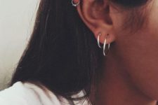 15 silver hoop earrings and a mathing little piercing ring with embellishements for a cool boho look