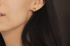 16 very thick yet small gold hoop earrings look rather modern and statement-like, despite their size