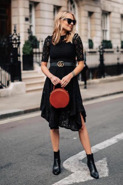 With black lace dress, belt and black ankle boots