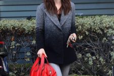 With black t-shirt, gray jeans and red bag