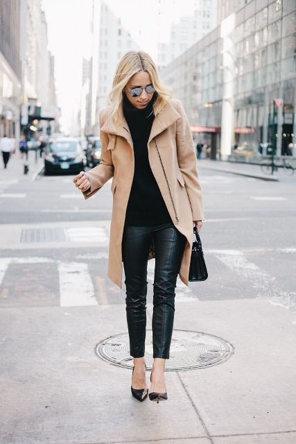 With black turtleneck sweater, black leather pants, bag and pumps