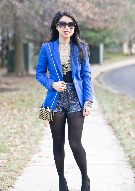 With lace shirt, pumps, blue blazer and chain strap mini bag