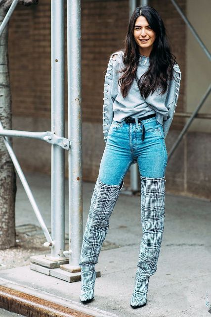 With lace up sweater and high-waisted jeans