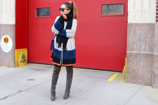 With mini skirt, black scarf, black tights, navy blue bag and gray over the knee boots
