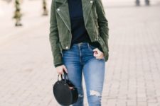 With navy blue sweater, distressed jeans, printed sneakers and olive green suede jacket