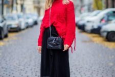 With red oversized sweater, black midi skirt and chain strap bag