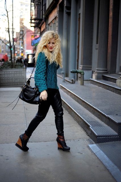 With sweater, black leather pants and black bag