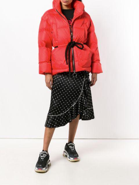With t-shirt, polka dot wrapped skirt and sneakers
