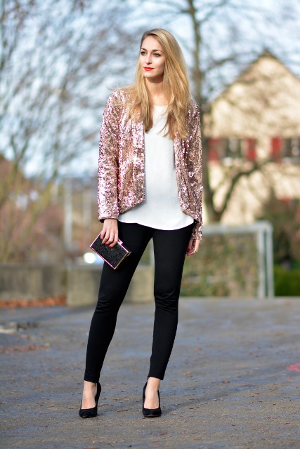 With white blouse, black skinny pants, mini clutch and black shoes