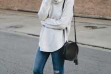 With white loose sweater, distressed skinny jeans and black flats