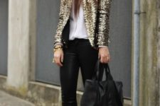 With white shirt, black pants, black bag and beige suede ankle boots