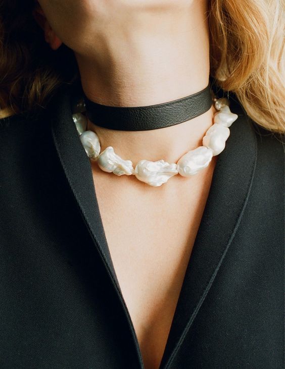 a black leather choker paired with a baroque pearl choker will create a super contrasting tough yet girlish look