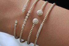 a combo of elegant and girlish bracelets of gold and diamonds that are similar but a bit different