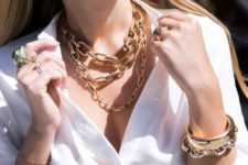 a layered gold chunky chain necklace plus a more delicate one, which is longer for a bold statement