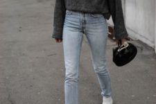 a minimal look with a grpahite grey sweater, light blue jeans, white booties and a small black bag