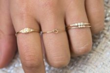 a number of rings including two stacked ones that are very complementing looks cool and bold