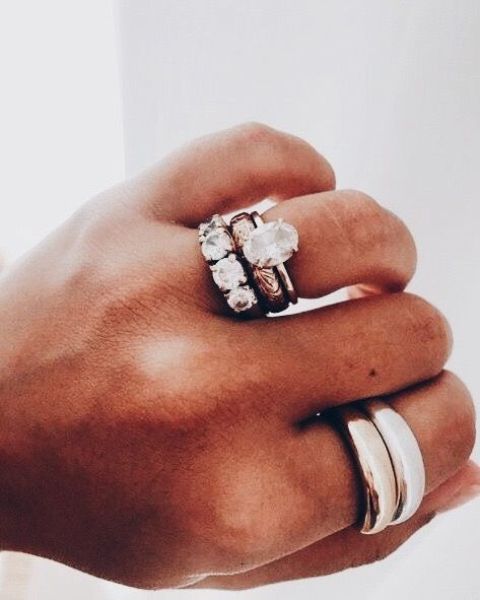a statement stackable ring set with large rhinestone ones and simple sleek thick ones