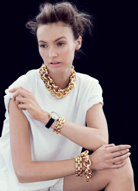 a touch of luxury with a chunky gold chain necklace and matching bracelets will raise your look to a new level