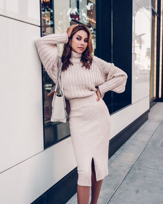 an oversized blush sweater, a blush midi pencil skirt with a front slit, a white bag for winter