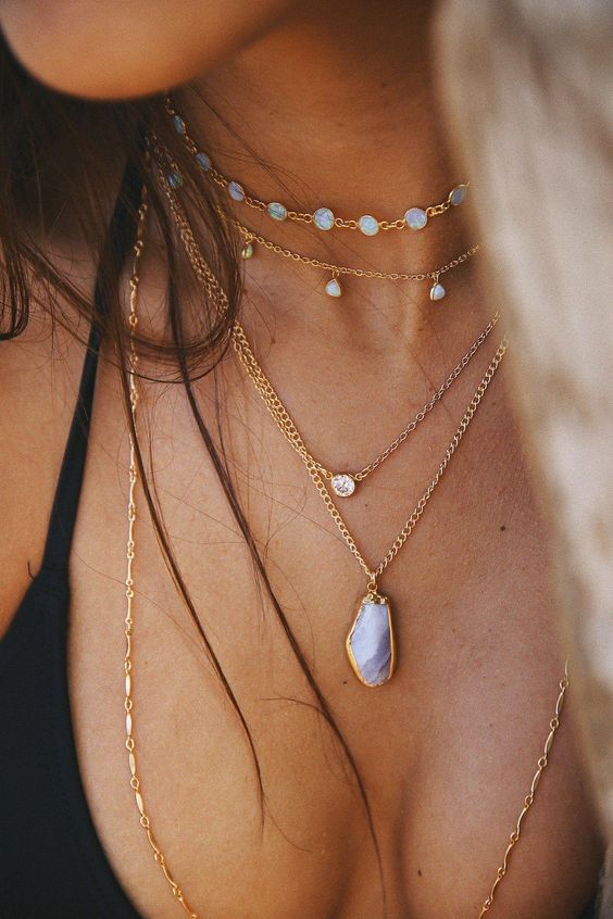 stacked gold necklaces with moonstones and agates look very free spirited and very chic