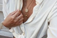 three necklaces – a chunky chain choker, two delicate chains with pendants for a cool boho look