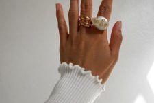 two statement rings – a rose gold swirl one and a baroque pearl one with gold dots for a girlish look